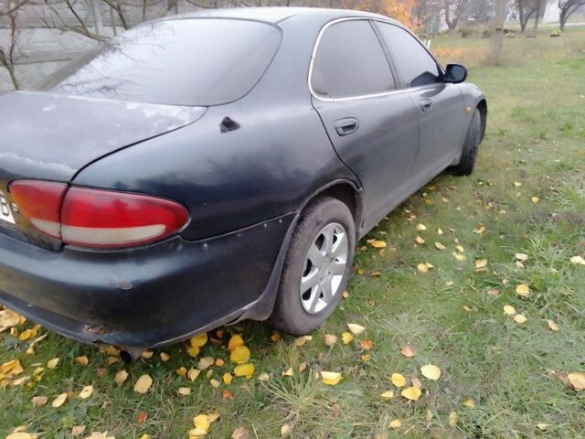 Зеленый Мазда Кседос 6, объемом двигателя 2 л и пробегом 400 тыс. км за 1500 $, фото 2 на Automoto.ua