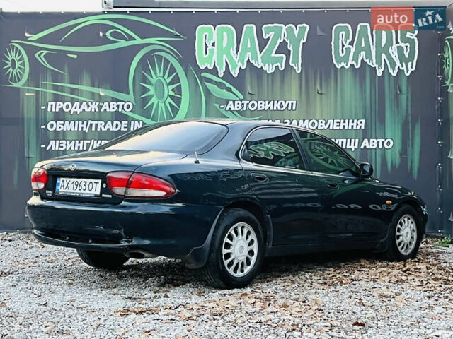 Зеленый Мазда Кседос 6, объемом двигателя 2 л и пробегом 213 тыс. км за 1900 $, фото 5 на Automoto.ua