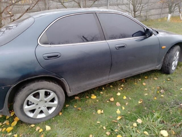 Зеленый Мазда Кседос 6, объемом двигателя 2 л и пробегом 400 тыс. км за 1500 $, фото 4 на Automoto.ua