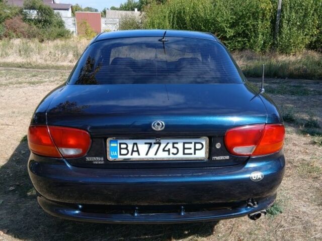 Зелений Мазда Кседос 6, об'ємом двигуна 2 л та пробігом 375 тис. км за 3100 $, фото 3 на Automoto.ua