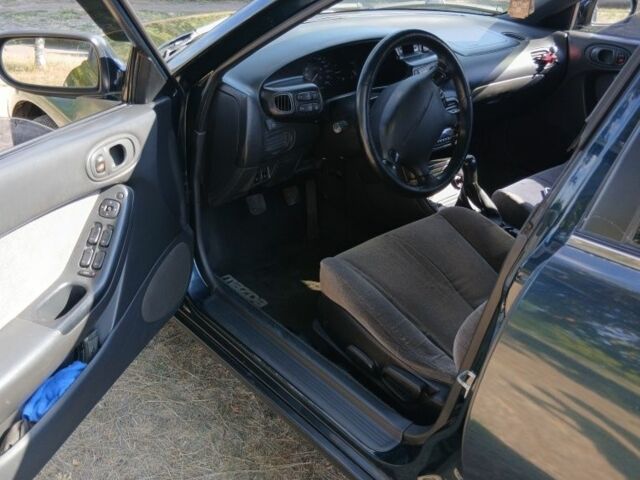 Зелений Мазда Кседос 6, об'ємом двигуна 2 л та пробігом 375 тис. км за 3100 $, фото 6 на Automoto.ua