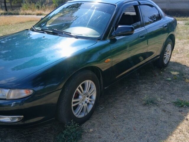 Зелений Мазда Кседос 6, об'ємом двигуна 2 л та пробігом 375 тис. км за 3100 $, фото 1 на Automoto.ua