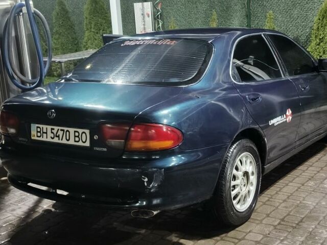 Зеленый Мазда Кседос 6, объемом двигателя 2 л и пробегом 300 тыс. км за 2600 $, фото 2 на Automoto.ua