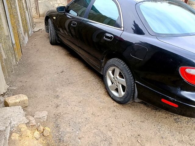 Чорний Мазда Кседос 9, об'ємом двигуна 2.5 л та пробігом 0 тис. км за 2000 $, фото 4 на Automoto.ua