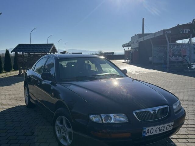 Красный Мазда Кседос 9, объемом двигателя 2.5 л и пробегом 200 тыс. км за 1850 $, фото 2 на Automoto.ua