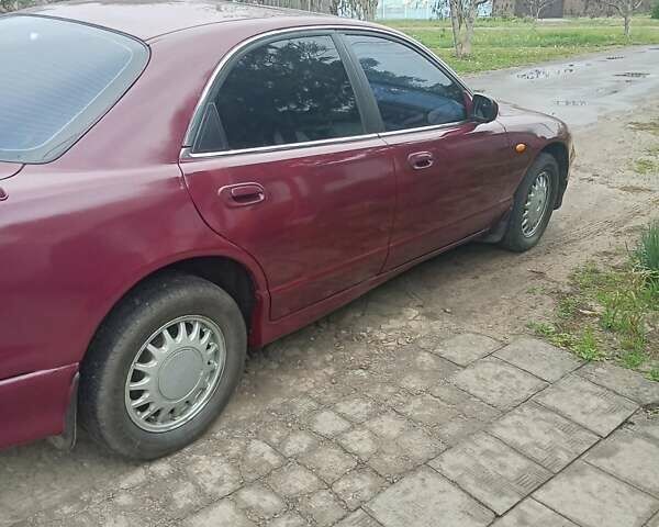 Красный Мазда Кседос 9, объемом двигателя 2.5 л и пробегом 170 тыс. км за 2750 $, фото 20 на Automoto.ua