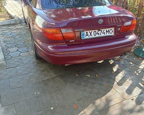 Красный Мазда Кседос 9, объемом двигателя 2.5 л и пробегом 170 тыс. км за 2750 $, фото 2 на Automoto.ua