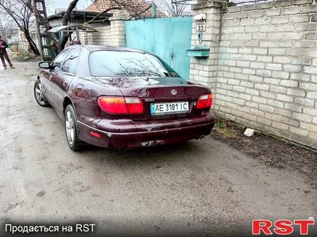 Красный Мазда Кседос 9, объемом двигателя 2 л и пробегом 200 тыс. км за 2500 $, фото 1 на Automoto.ua