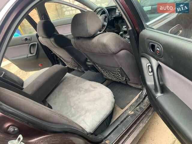 Красный Мазда Кседос 9, объемом двигателя 2 л и пробегом 285 тыс. км за 2000 $, фото 1 на Automoto.ua