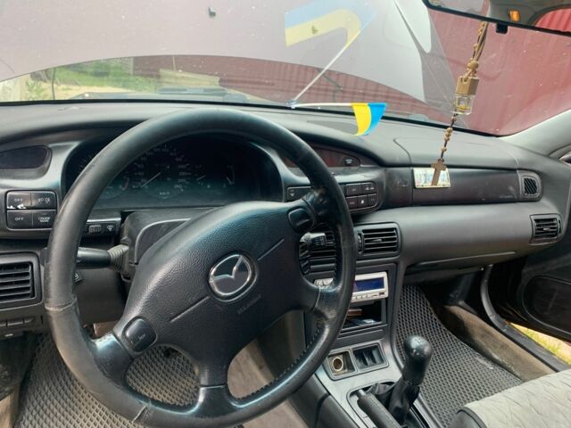 Червоний Мазда Кседос 9, об'ємом двигуна 2 л та пробігом 285 тис. км за 2000 $, фото 6 на Automoto.ua