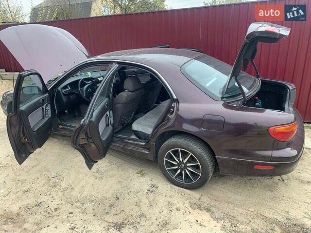 Красный Мазда Кседос 9, объемом двигателя 2 л и пробегом 285 тыс. км за 2000 $, фото 9 на Automoto.ua