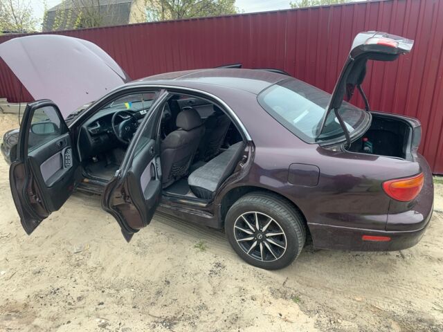 Червоний Мазда Кседос 9, об'ємом двигуна 2 л та пробігом 285 тис. км за 2000 $, фото 10 на Automoto.ua