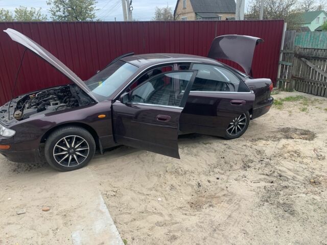 Червоний Мазда Кседос 9, об'ємом двигуна 2 л та пробігом 285 тис. км за 2000 $, фото 5 на Automoto.ua