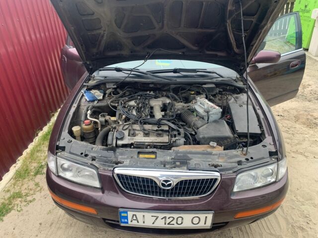 Червоний Мазда Кседос 9, об'ємом двигуна 2 л та пробігом 285 тис. км за 2000 $, фото 4 на Automoto.ua