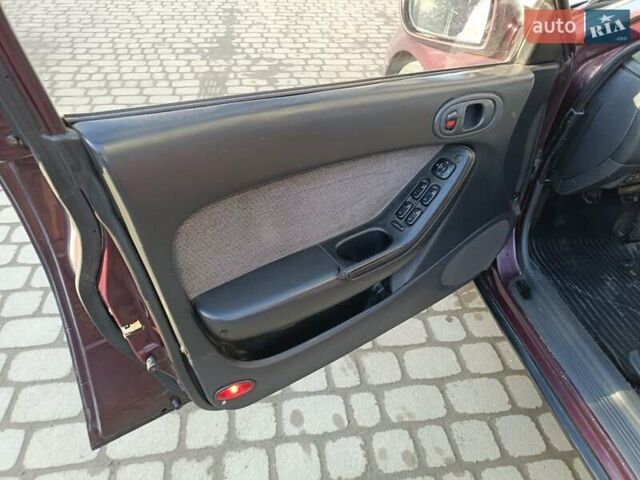 Красный Мазда Кседос 9, объемом двигателя 2 л и пробегом 240 тыс. км за 2050 $, фото 20 на Automoto.ua