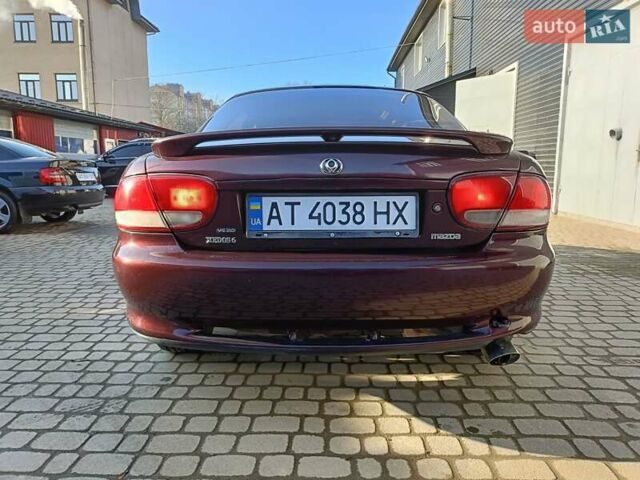 Красный Мазда Кседос 9, объемом двигателя 2 л и пробегом 240 тыс. км за 2050 $, фото 4 на Automoto.ua