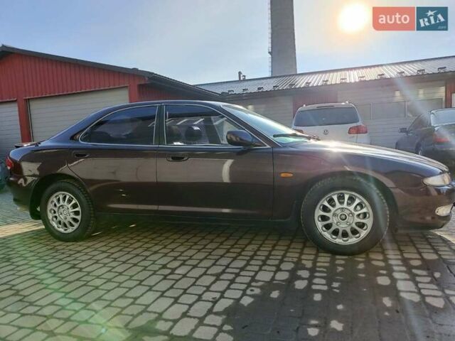 Красный Мазда Кседос 9, объемом двигателя 2 л и пробегом 240 тыс. км за 2050 $, фото 6 на Automoto.ua