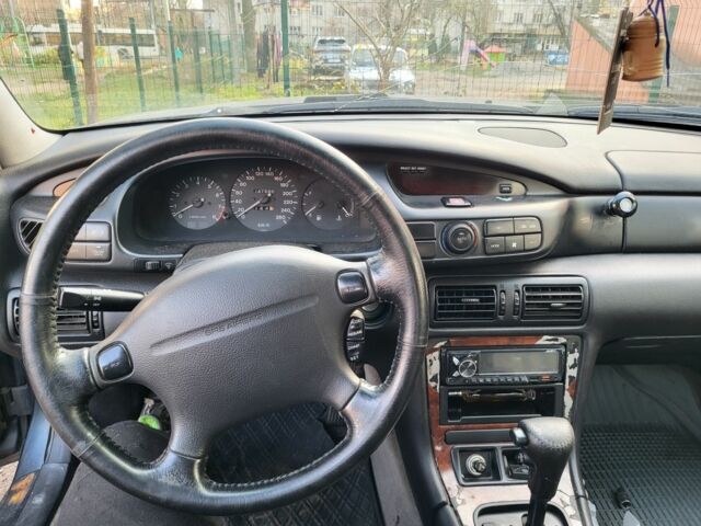 Серый Мазда Кседос 9, объемом двигателя 2.5 л и пробегом 240 тыс. км за 1100 $, фото 2 на Automoto.ua