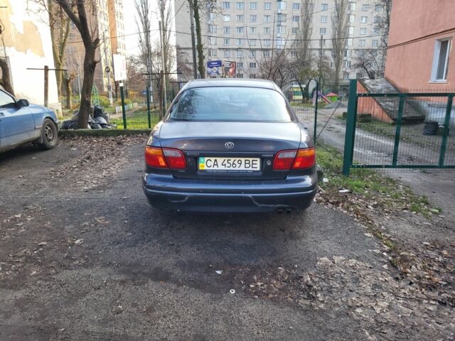 Серый Мазда Кседос 9, объемом двигателя 2.5 л и пробегом 240 тыс. км за 1100 $, фото 8 на Automoto.ua