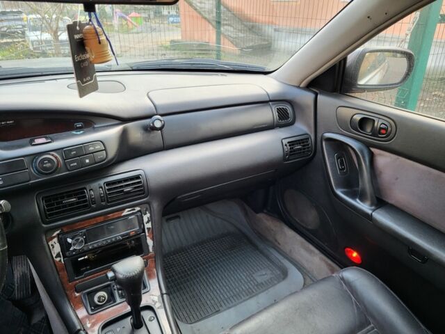 Серый Мазда Кседос 9, объемом двигателя 2.5 л и пробегом 240 тыс. км за 1100 $, фото 1 на Automoto.ua