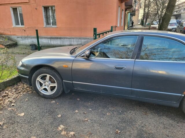 Серый Мазда Кседос 9, объемом двигателя 2.5 л и пробегом 240 тыс. км за 1100 $, фото 5 на Automoto.ua