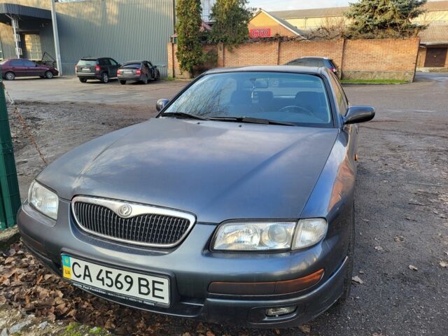 Серый Мазда Кседос 9, объемом двигателя 2.5 л и пробегом 240 тыс. км за 1100 $, фото 4 на Automoto.ua