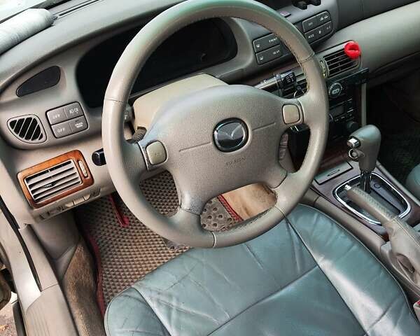 Серый Мазда Кседос 9, объемом двигателя 2.5 л и пробегом 274 тыс. км за 2700 $, фото 4 на Automoto.ua