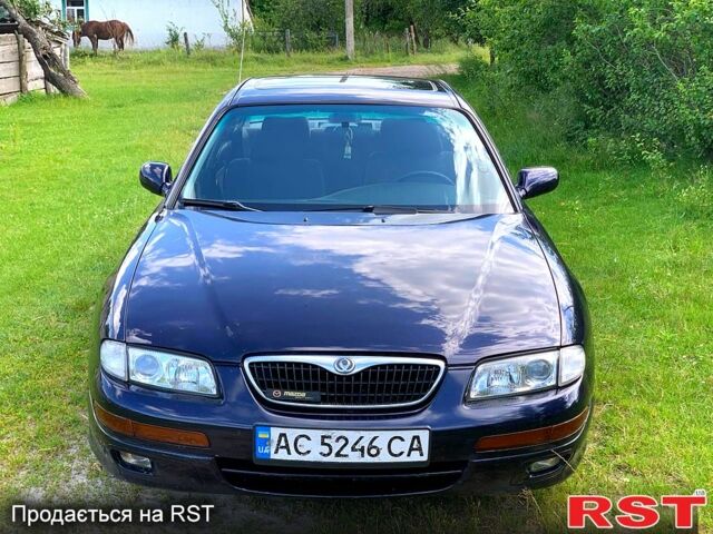 Синий Мазда Кседос 9, объемом двигателя 2 л и пробегом 350 тыс. км за 3300 $, фото 1 на Automoto.ua