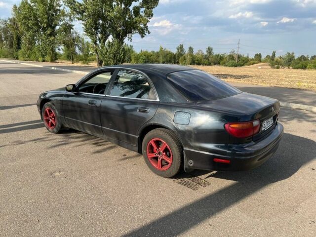 Синий Мазда Кседос 9, объемом двигателя 2.5 л и пробегом 420 тыс. км за 1800 $, фото 1 на Automoto.ua