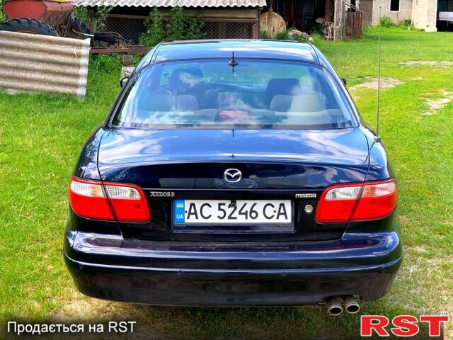 Синий Мазда Кседос 9, объемом двигателя 2 л и пробегом 350 тыс. км за 3300 $, фото 7 на Automoto.ua