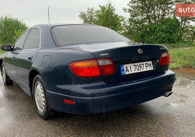 Синий Мазда Кседос 9, объемом двигателя 2.5 л и пробегом 380 тыс. км за 2100 $, фото 4 на Automoto.ua