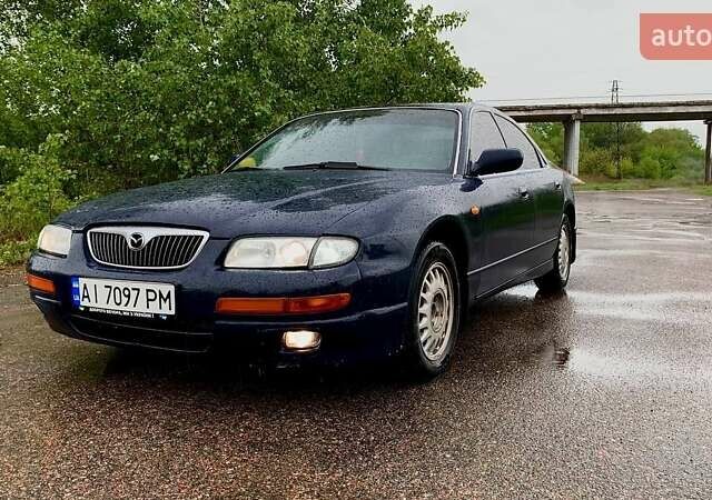 Синий Мазда Кседос 9, объемом двигателя 2.5 л и пробегом 380 тыс. км за 2100 $, фото 1 на Automoto.ua