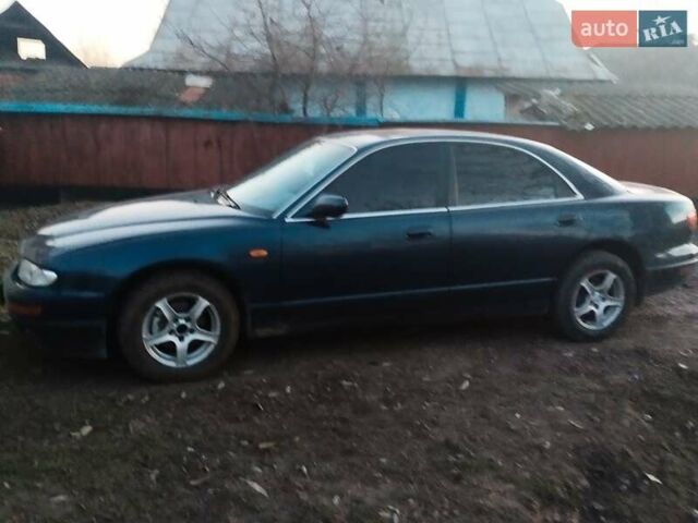 Синий Мазда Кседос 9, объемом двигателя 2 л и пробегом 442 тыс. км за 1700 $, фото 1 на Automoto.ua