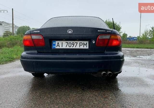 Синий Мазда Кседос 9, объемом двигателя 2.5 л и пробегом 380 тыс. км за 2100 $, фото 5 на Automoto.ua