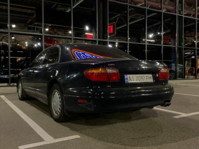 Синий Мазда Кседос 9, объемом двигателя 2.5 л и пробегом 385 тыс. км за 2200 $, фото 1 на Automoto.ua