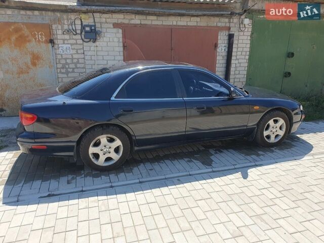 Синий Мазда Кседос 9, объемом двигателя 2.5 л и пробегом 350 тыс. км за 1600 $, фото 2 на Automoto.ua