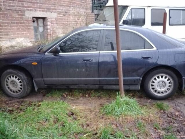 Синий Мазда Кседос 9, объемом двигателя 2.3 л и пробегом 250 тыс. км за 2200 $, фото 1 на Automoto.ua