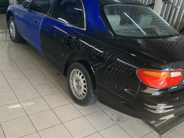 Синий Мазда Кседос 9, объемом двигателя 0 л и пробегом 200 тыс. км за 800 $, фото 3 на Automoto.ua