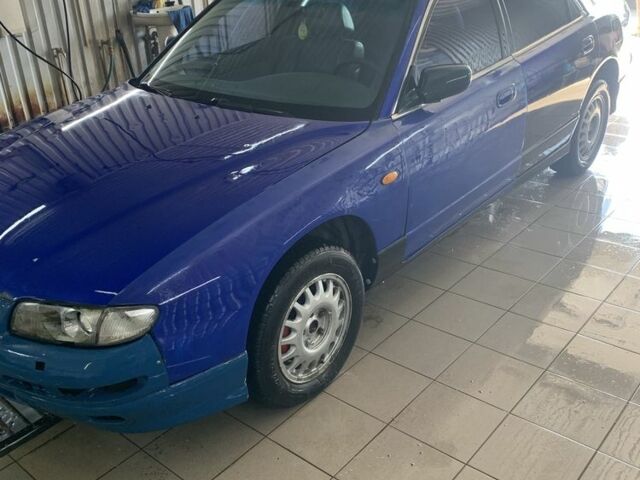 Синий Мазда Кседос 9, объемом двигателя 0 л и пробегом 200 тыс. км за 800 $, фото 1 на Automoto.ua