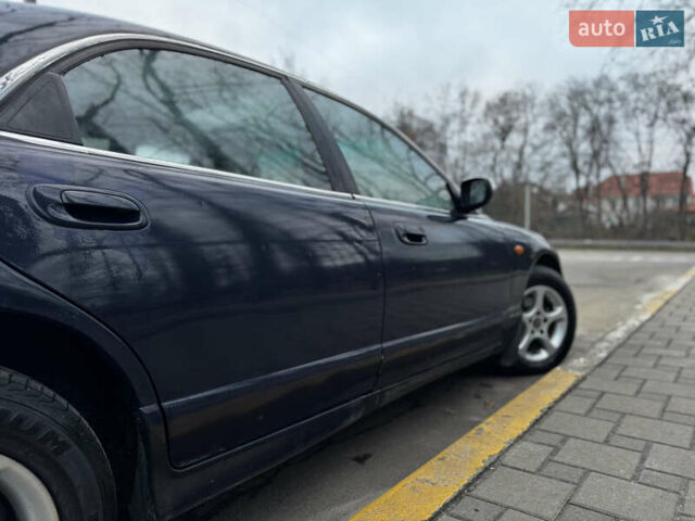 Синий Мазда Кседос 9, объемом двигателя 2.26 л и пробегом 185 тыс. км за 2200 $, фото 8 на Automoto.ua