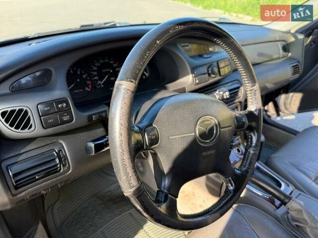 Синий Мазда Кседос 9, объемом двигателя 2.5 л и пробегом 285 тыс. км за 3200 $, фото 43 на Automoto.ua