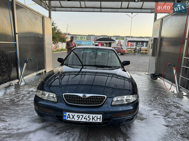 Синий Мазда Кседос 9, объемом двигателя 2.5 л и пробегом 288 тыс. км за 3500 $, фото 1 на Automoto.ua