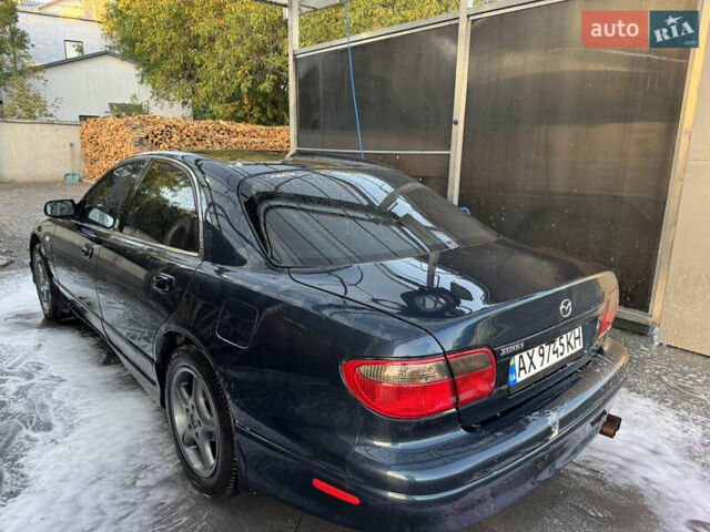 Синий Мазда Кседос 9, объемом двигателя 2.5 л и пробегом 288 тыс. км за 3500 $, фото 2 на Automoto.ua