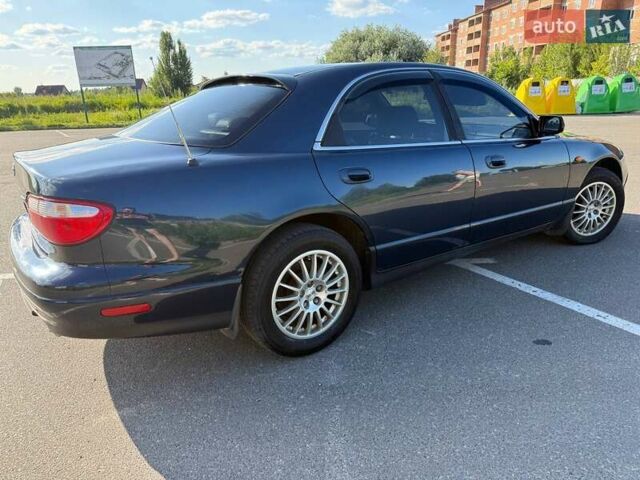 Синий Мазда Кседос 9, объемом двигателя 2.5 л и пробегом 285 тыс. км за 3200 $, фото 79 на Automoto.ua