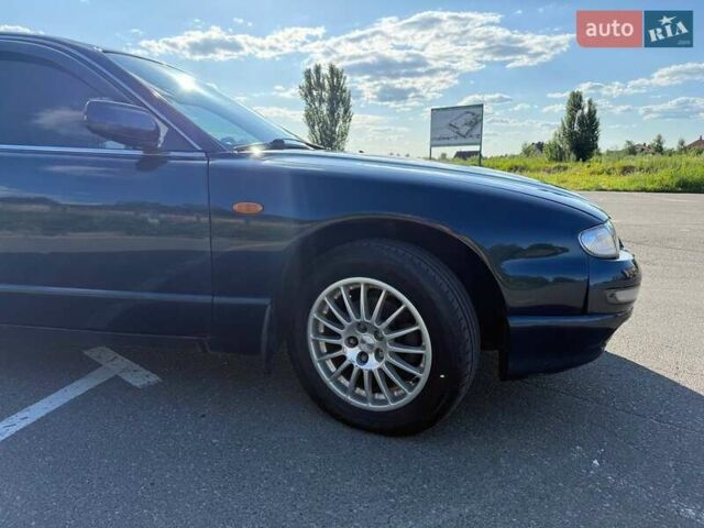 Синий Мазда Кседос 9, объемом двигателя 2.5 л и пробегом 285 тыс. км за 3200 $, фото 80 на Automoto.ua