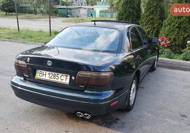 Зеленый Мазда Кседос 9, объемом двигателя 2.5 л и пробегом 270 тыс. км за 1730 $, фото 5 на Automoto.ua