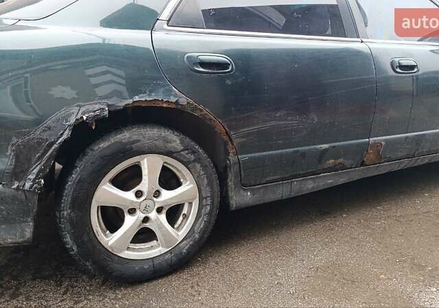 Зеленый Мазда Кседос 9, объемом двигателя 2.5 л и пробегом 354 тыс. км за 1500 $, фото 7 на Automoto.ua