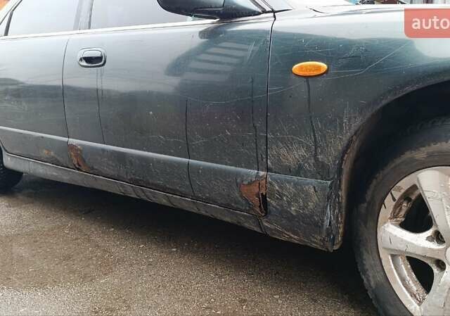 Зеленый Мазда Кседос 9, объемом двигателя 2.5 л и пробегом 354 тыс. км за 1500 $, фото 1 на Automoto.ua