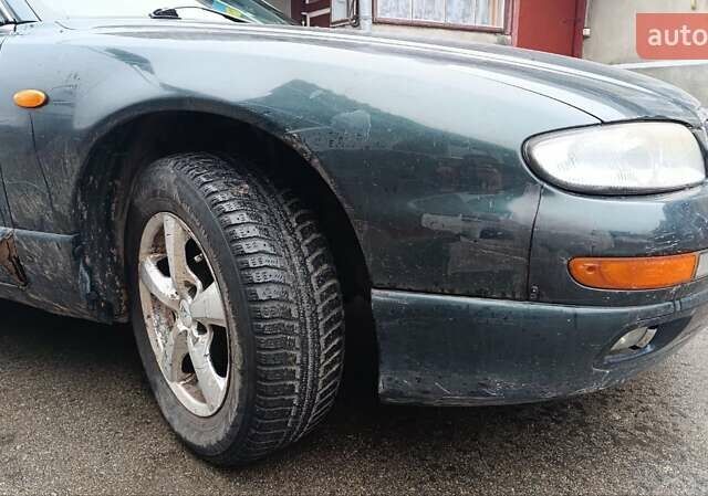 Зеленый Мазда Кседос 9, объемом двигателя 2.5 л и пробегом 354 тыс. км за 1500 $, фото 2 на Automoto.ua