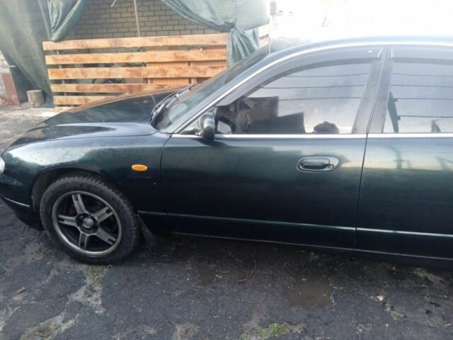 Зеленый Мазда Кседос 9, объемом двигателя 2.5 л и пробегом 1000 тыс. км за 2500 $, фото 5 на Automoto.ua